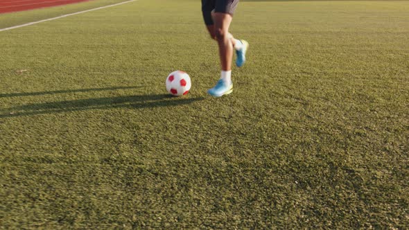 Closeup of a Legs of a Black Soccer Player Practicing Ball Possession in a Training Session alt