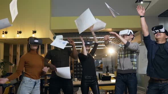 Cheerful Office Workers Group in VR Virtual Glasses Throwing Paper Documents alt