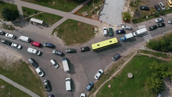 Aerial Drone Flight Top Down View of Stuck Cars and Buses on Crossroad at Rush Hour Heavy Traffic alt
