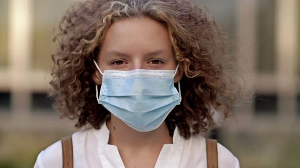 Portrait of a Schoolgirl in a Protective Mask