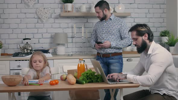 Family using their gadgets at home alt