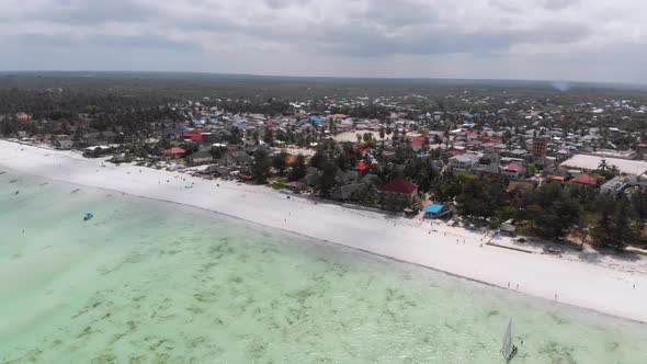 Ocean Coastline with Paradise Beach Hotels and Palm Trees Zanzibar Aerial View alt