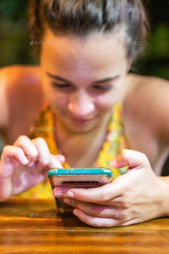 Woman typing on mobile phone - Stock Photo - Images