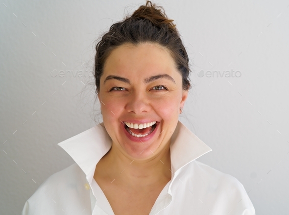 Portrait of laughing 40 years old woman. Candid sincere emotions 