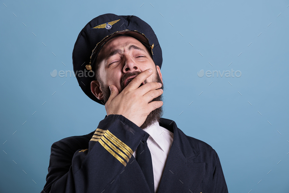 Tired airplane aviator yawning closeup - Stock Photo - Images