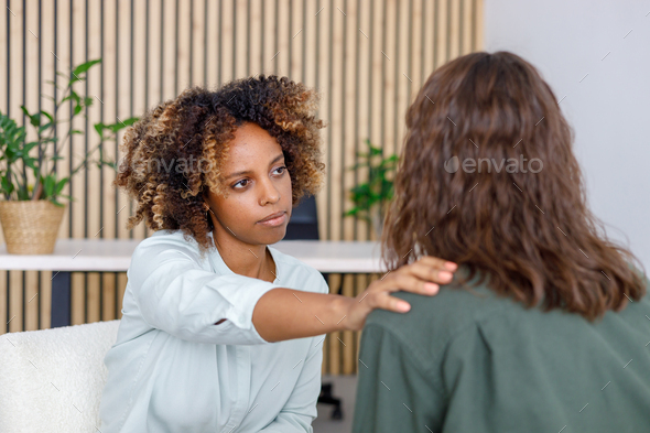 African American female psychologist conducts an appointment with a patient in the office. mental