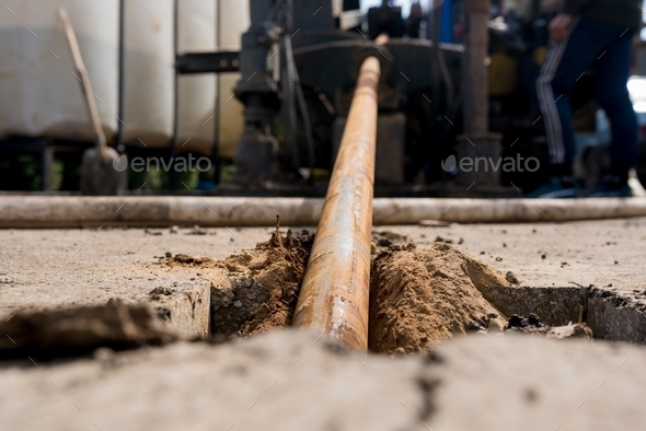 Horizontal directional drilling technology closeup. Drilling machine work process.  - Stock Photo - Images