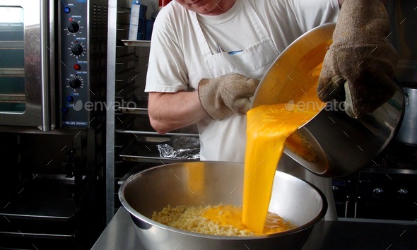 Mac and cheese preparation in large volume in commercial kitchen, food production, business