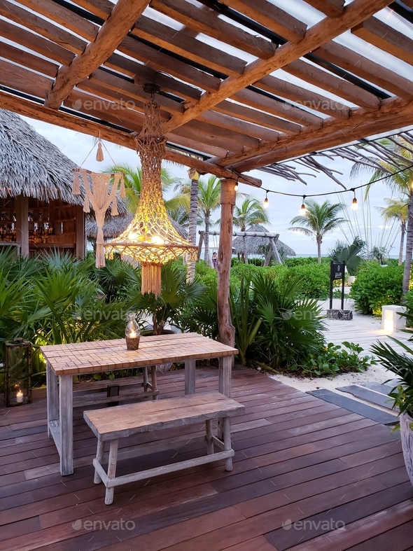 Macrame chandelier hanged outdoor at beachside terrace for cozy romantic look decor