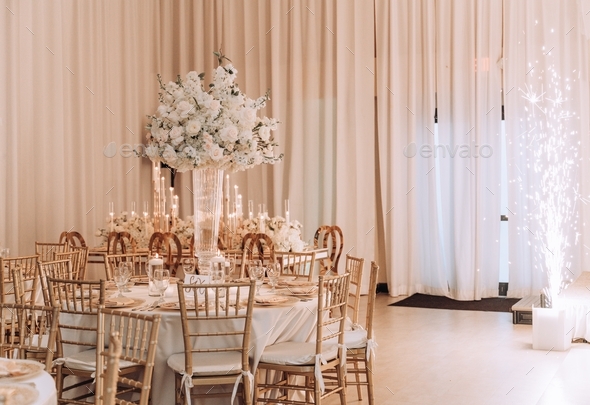 Elegant event set up with floral arrangements and candlelight