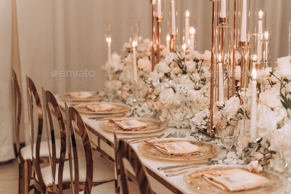 Elegant event set up with floral arrangements and candlelight tablescape