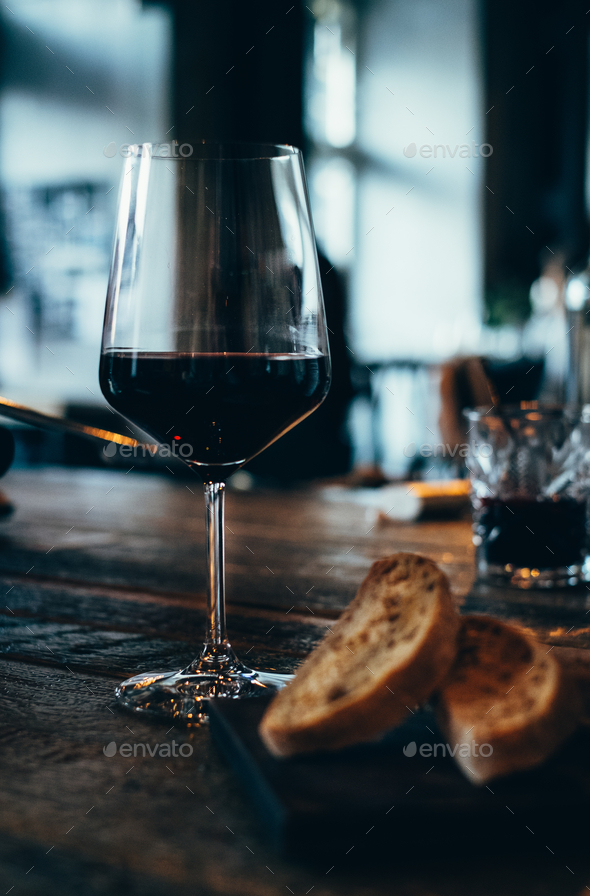 glass of red wine in a bar Stock Photo by alesha_macarosha PhotoDune