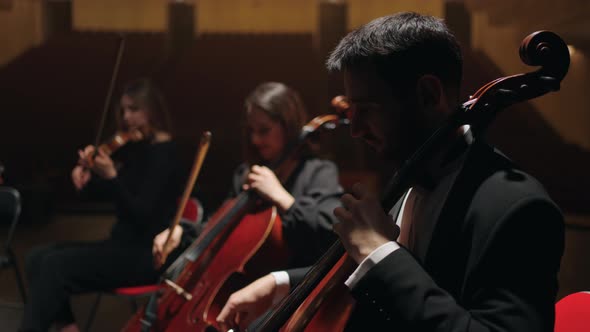Rehearsal of Symphonic Orchestra in Opera House Cellists are Playing on Scene of Philharmonic Hall alt