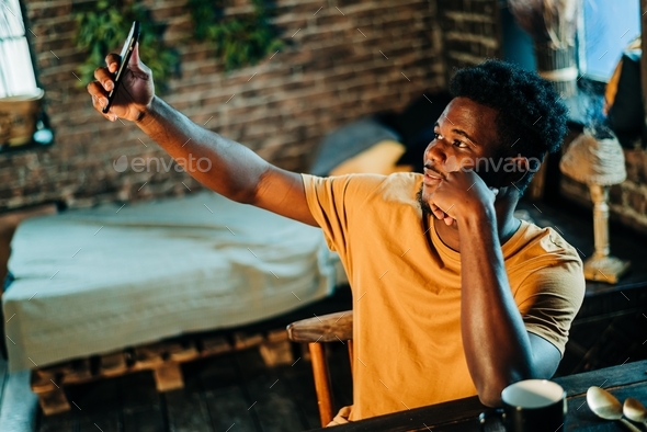 Young Attractive Black Man Taking Self Portrait Mobile Phone Device