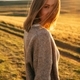 portrait of beautiful woman walking on field at sunset  - PhotoDune Item for Sale