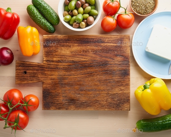 Vegetables, cutting board. Greek salad horiatiki. Top view, copy space. Menu, recipe, mock up