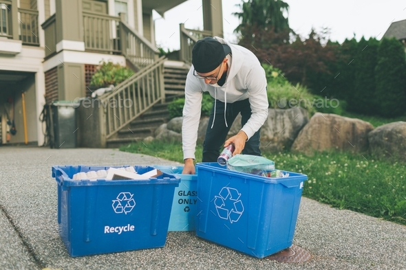 A man sorting the recycling at home.