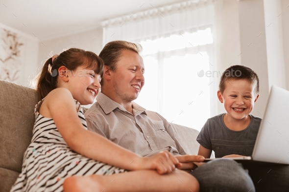 Dad and children call mom or grandmother via the Internet.