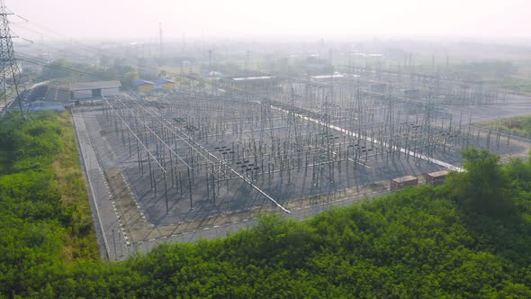 Aerial view of electricity generating, voltage poles. Power lines on utility tower and cable wires alt