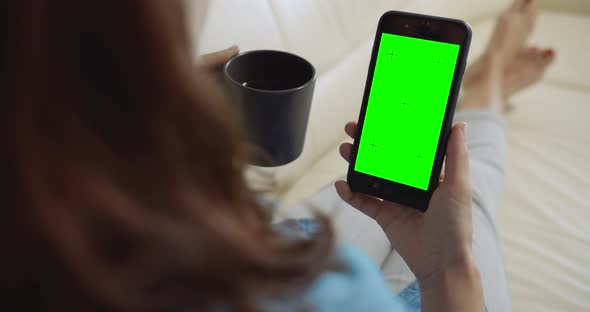 Woman Holding Greenscreen Smartphone