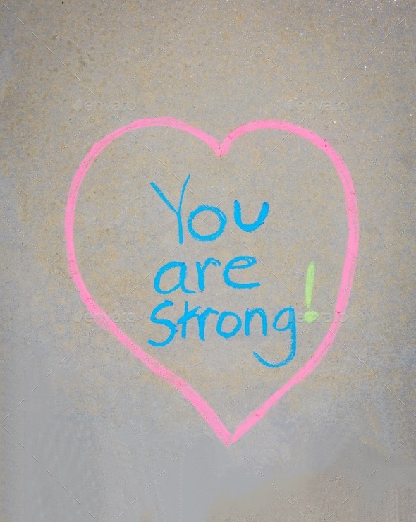 You are strong written in a heart in chalk on the sidewalk