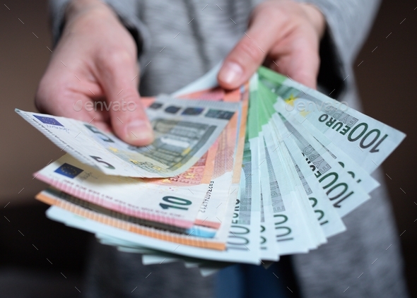 Woman counts money. female hands hold and count cash banknotes 5, 10, 100 euro banknotes currency