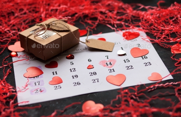 Flat lay layout for holiday for Valentine\'s Day with date of 14 February in calendar, copy space