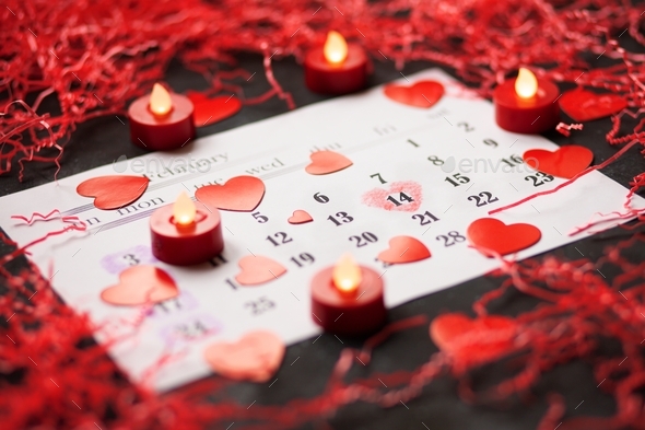Flat lay layout for holiday for Valentine\'s Day with date of 14 February in calendar, copy space.