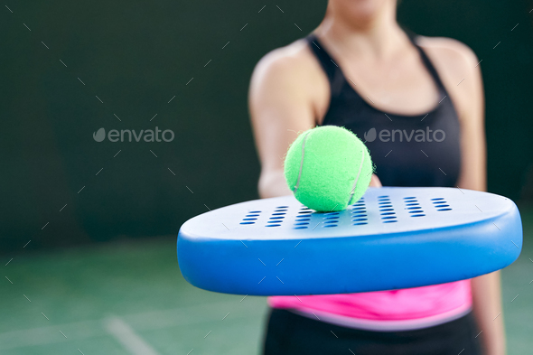 Athlete with padel racket and padel ball on the court, close-up. Stock ...