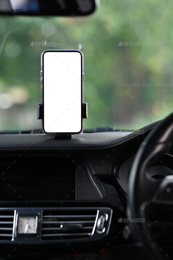 Smart phone with blank screen in car windshield holder. Empty screen for your advertise design.