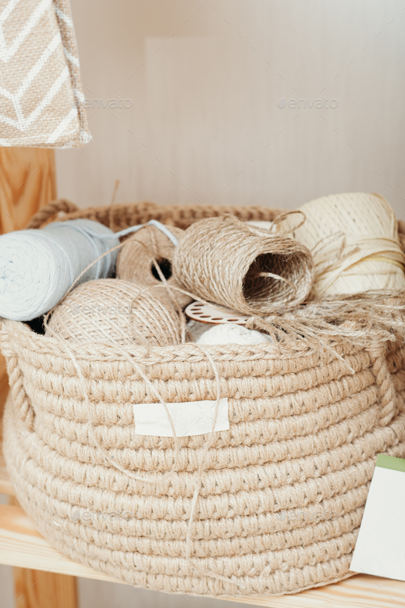 jute and cotton skeins and balls, eco knitted basket with knitting accessories. - Stock Photo - Images