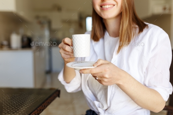 Cafe breakfast coffee lifestyle cropped smiling woman pouring filter decaf from french press coffee