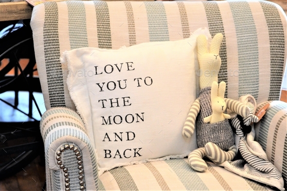 comfortable chair with pillow that says love you to the moon and back
