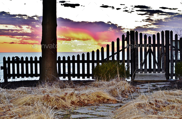 Fence with a sunset in the background  - Stock Photo - Images