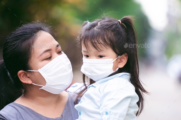 Family wear masks to prevent spread of COVID-19 when in public areas.