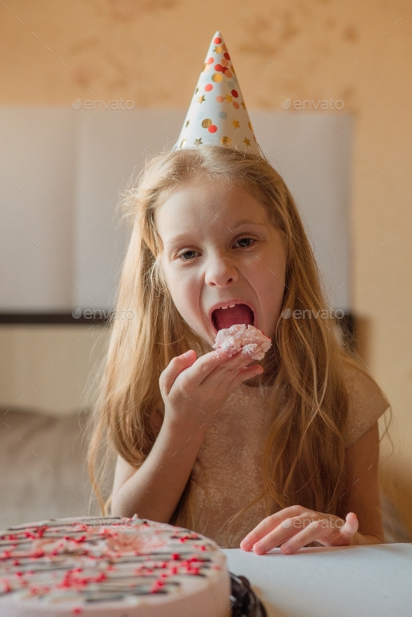 little girl eating cake