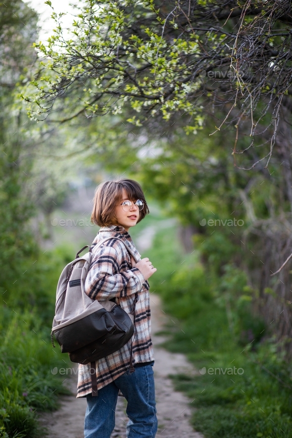 a teenager in glasses and casual clothes  - Stock Photo - Images