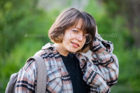 a teenager in glasses and casual clothes  - Stock Photo - Images
