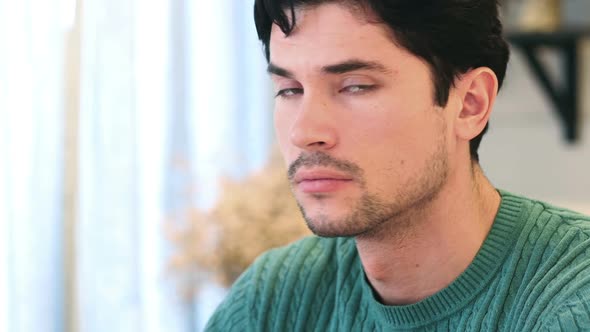 Close Up of Young AfroAmerican Man Looking on Side at Camera alt