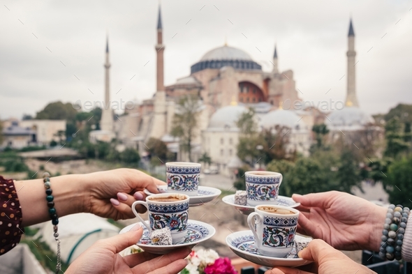 Woman travel in Istanbul and and drink turkey coffee in cafe near Hagia Sophia famous islamic Landma