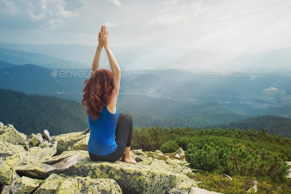Woman feel freedom and enjoy the beautiful view in the mountains - Stock Photo - Images