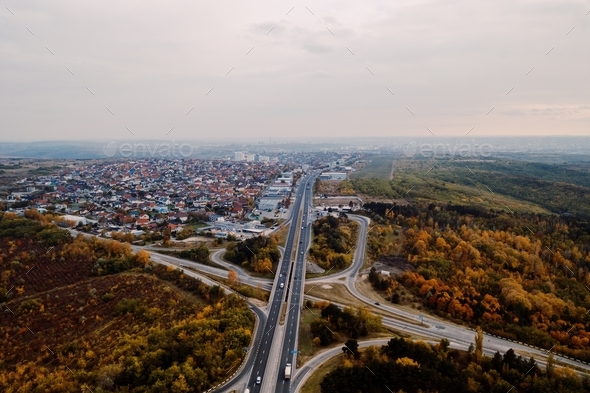 Aerial view of road system passing among autumn city landscape. Wallpaper Earth environment