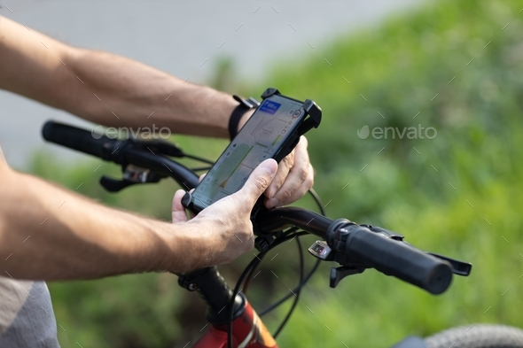 Navigator mobile phone on bike  - Stock Photo - Images