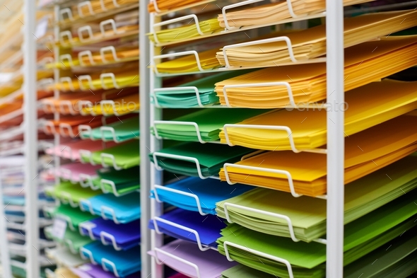 Colorful art papers on shelf display in stationery store