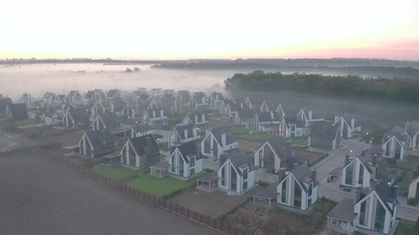 Townhouse at Dawn with Fog That Hangs in Layers. Light Haze. Oak Forest, Field