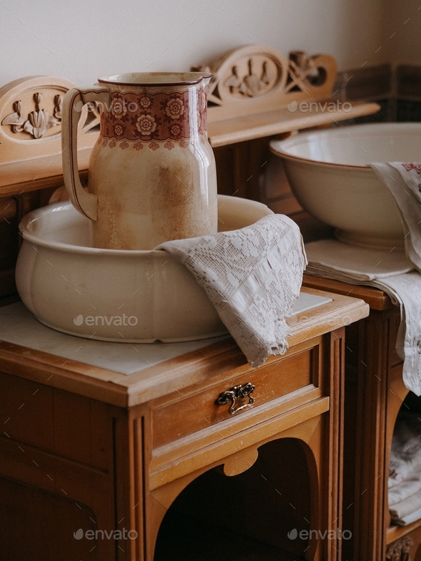 vintage jug on an old dresser in a vintage bathroom at home Stock Photo by oliamagnolia