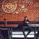 Young teenager using mobile in a cafe - PhotoDune Item for Sale