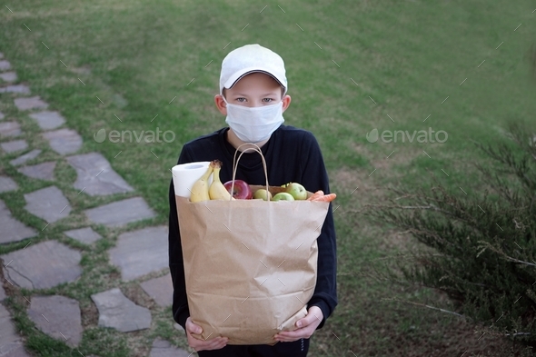 A young boy works as a courier during social isolation