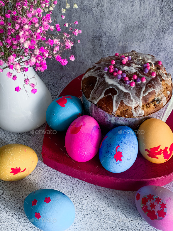 Easter food composition painted a piece of Easter cake and colored eggs