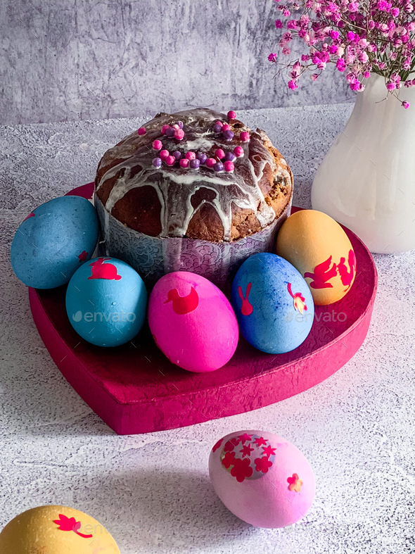 Easter food composition painted a piece of Easter cake and colored eggs